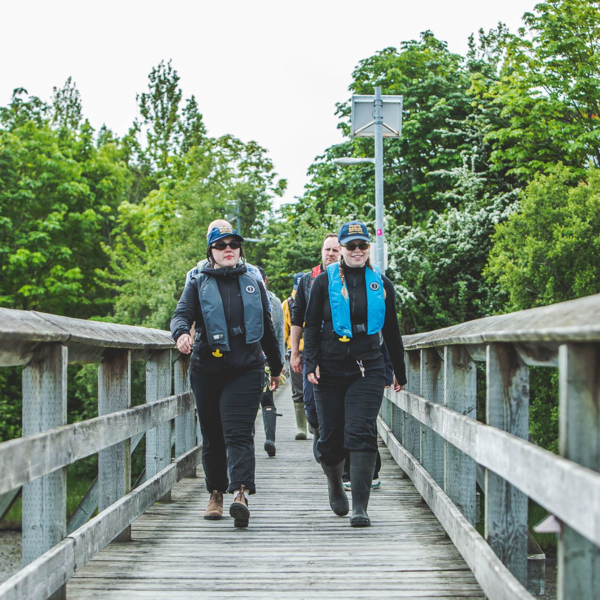 women walking down a dock
