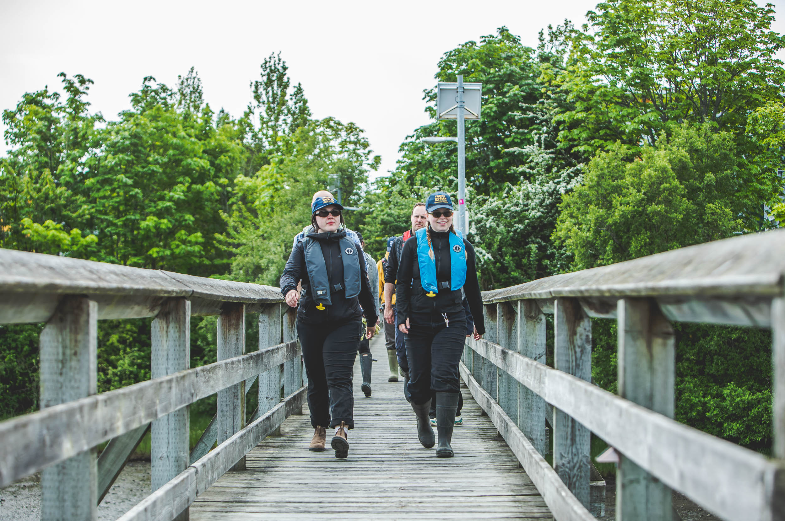 women walking down a dock