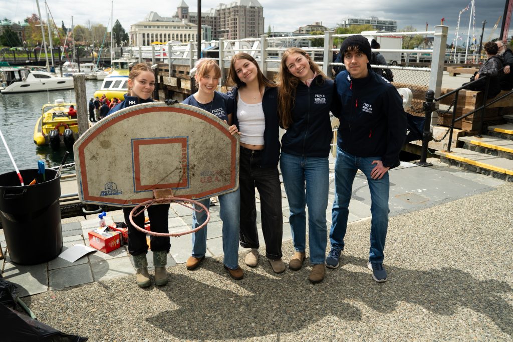 Office team with thrown out basketball hoop