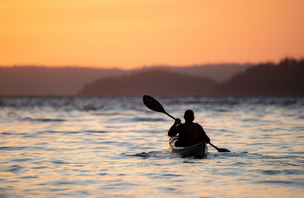 Kayaker at sunset
